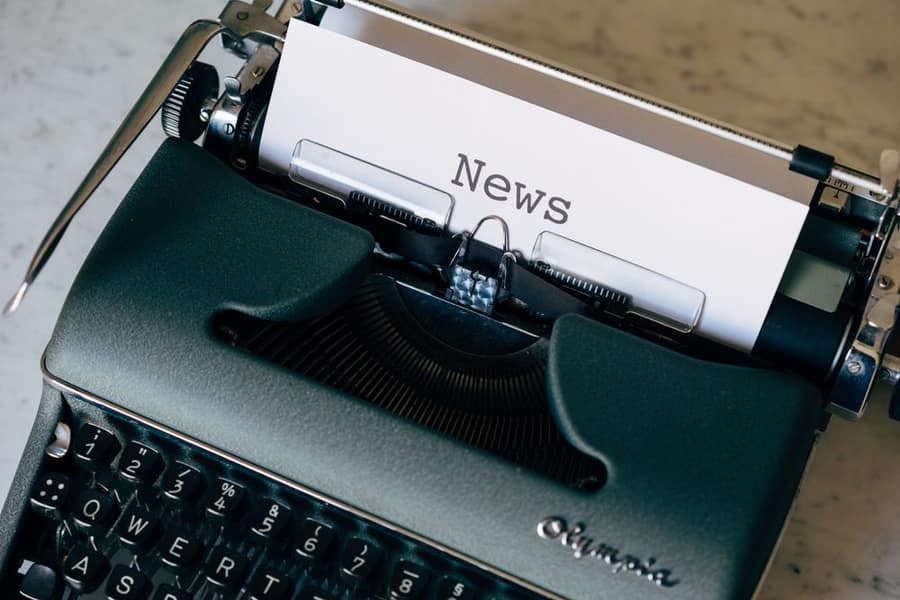 A typewriter with a page titled News